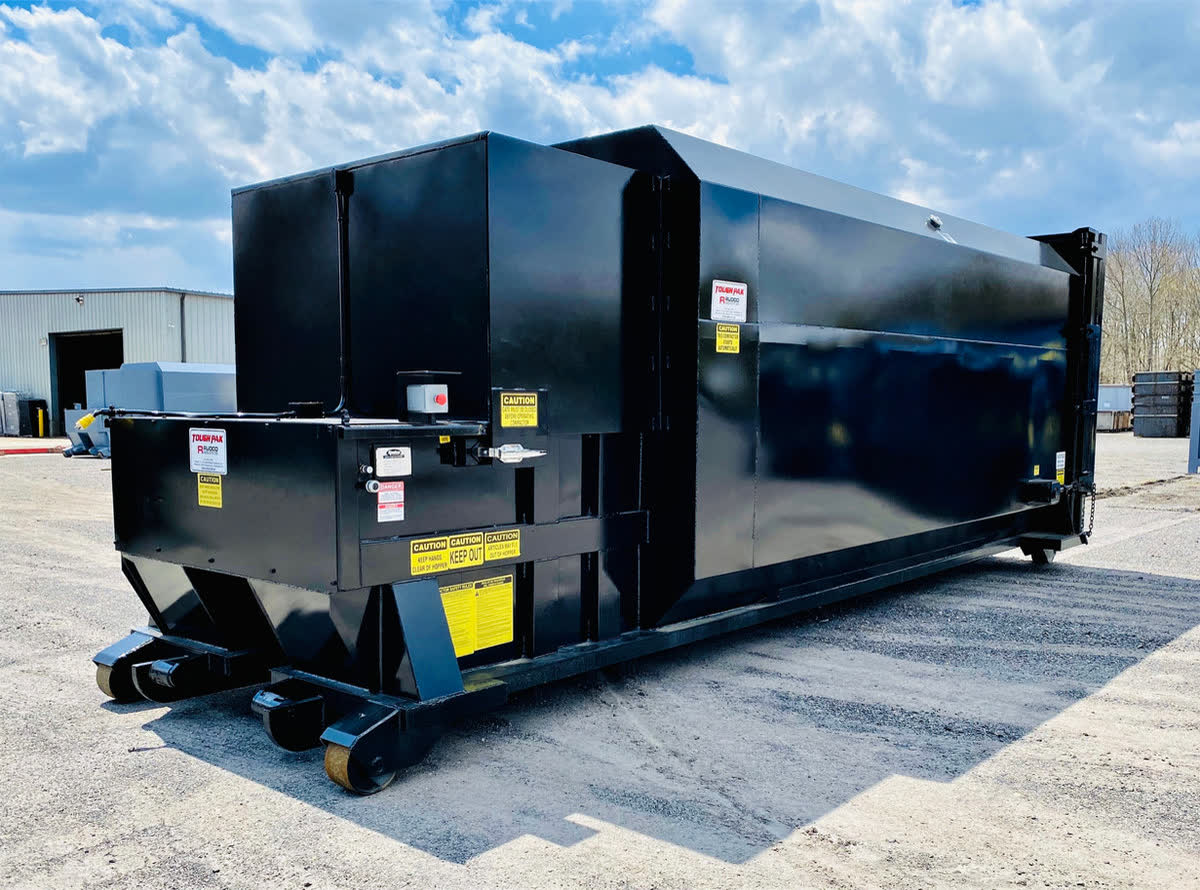 Black self-contained compactor with single door side feed doghouse